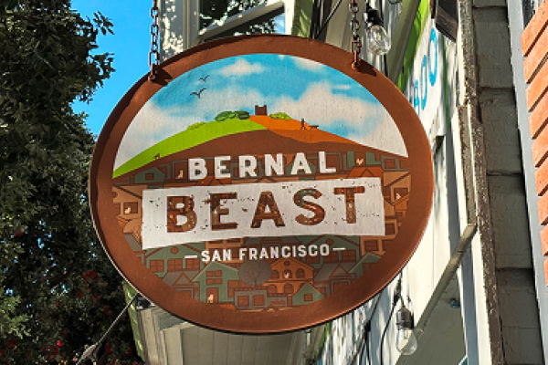 A round sign reads "Bernal Beast San Francisco" with a hill, houses, and birds illustrated in the background.
